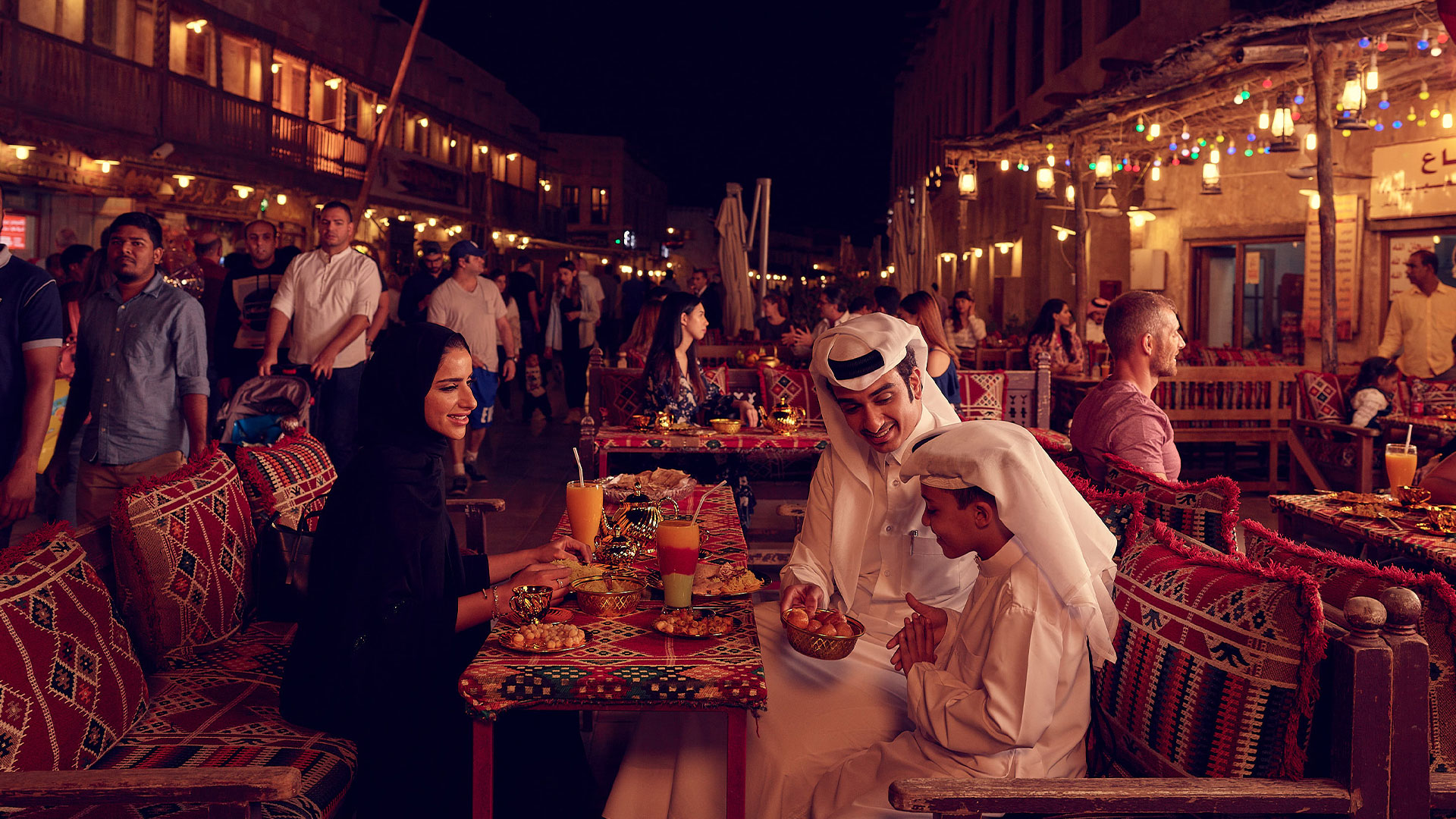 A family sitting at a restaurant in the souq